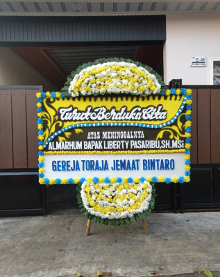 Papan Bunga Duka di Sukorambi